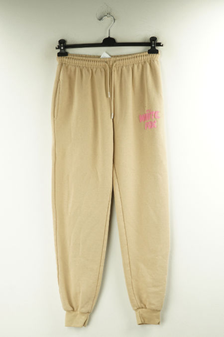 Spodnie beżowe dresowe z różowym napisem