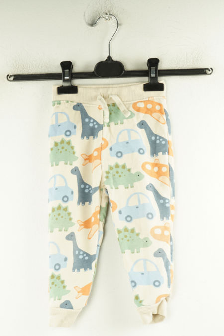 Spodnie dresowe beżowe w dinozaury i auta